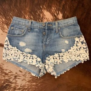 CARMAR denim jean shorts w white floral appliqué
